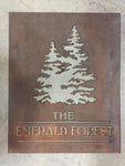 Metal address sign with evergreens Or deciduous tree