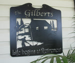 Metal FISHERMAN sign with fisherman and cabin