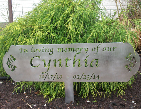 Metal, in memory sign on stake