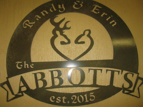 Metal sign with buck doe symbol
